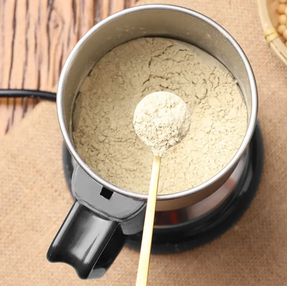 Multifunctional Mini Grinder in use on a beige background